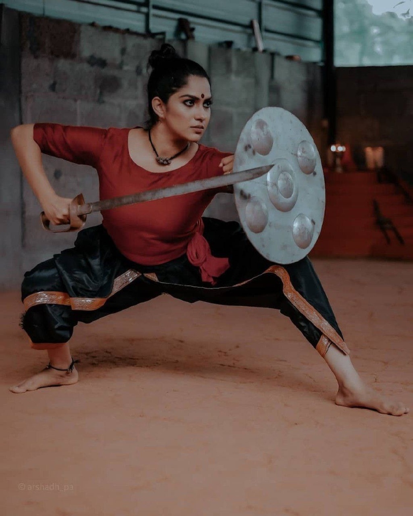 Female Kalaripayattu warrior with sword and shield